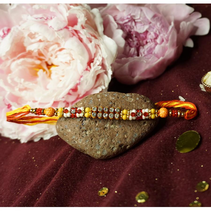 Eye-catchy Simple Rakhi W/ Pearls and Diamonds + Roli & Chaval Eye-catchy Simple Rakhi W/ Pearls and Diamonds + Roli & Chaval
