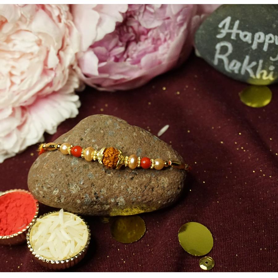 Traditional RAKHI Crafted W/ Rudraksha and beautiful Beads + Roli & Chaval Traditional RAKHI Crafted W/ Rudraksha and beautiful Beads + Roli & Chaval