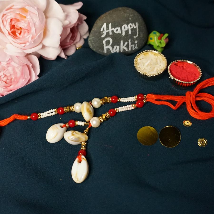 Attractive Lumba Rakhi Made With Sea Shalls & Beads + Roli/Chaval