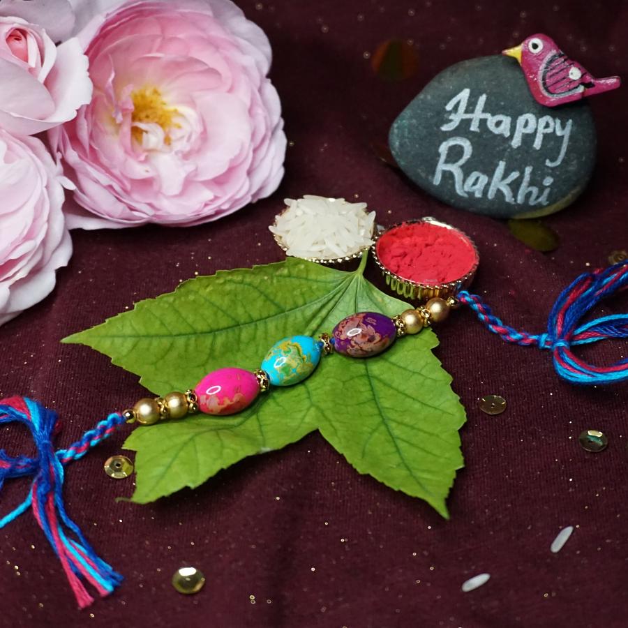 Rakhi made With Delicate Indonesian Beads + Roli and Chaval Rakhi made With Delicate Indonesian Beads + Roli and Chaval