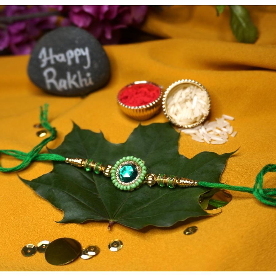 Green Gem Stone Rakhi Surrounded By Green Beads + Roli & Chaval