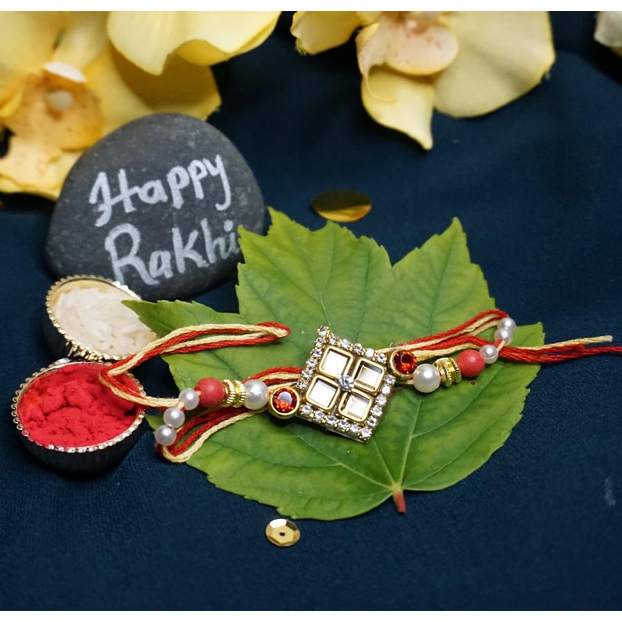 Delicate Kundan Rakhi Surrounded By An Amreican Diamonds + Roli & Chaval