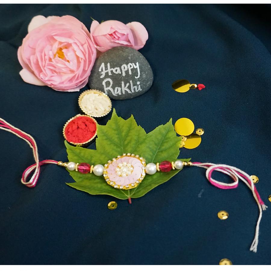 Beautiful Flower Rakhi Surrounded By an American Diamonds+ Roli/Chaval Beautiful Flower Rakhi Surrounded By an American Diamonds+ Roli/Chaval