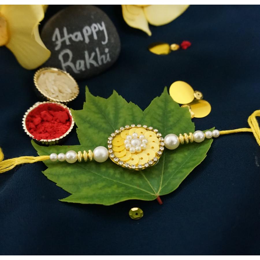 Beautiful yellow Flower Rakhi Surrounded By Diamonds+ Roli/Chaval Beautiful yellow Flower Rakhi Surrounded By Diamonds+ Roli/Chaval