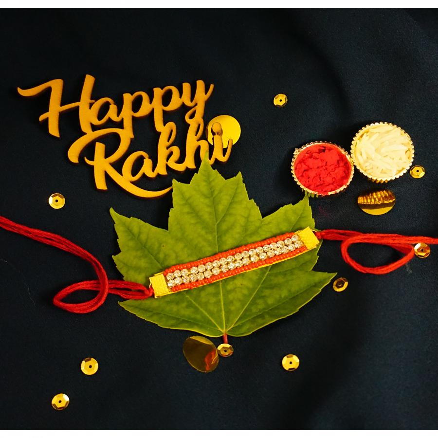 Diamond RAKHI Designed With Red Beads + Roli & Chaval Diamond RAKHI Designed With Red Beads + Roli & Chaval