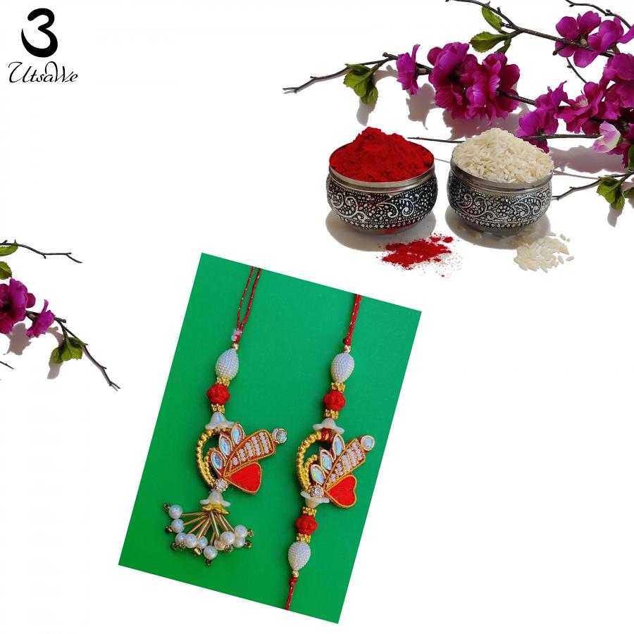 Handcrafted Lumba Bhaiya Bhabhi Zardosi Rakhi in Red & White +Roli & Chaval Handcrafted Lumba Bhaiya Bhabhi Zardosi Rakhi in Red & White +Roli & Chaval