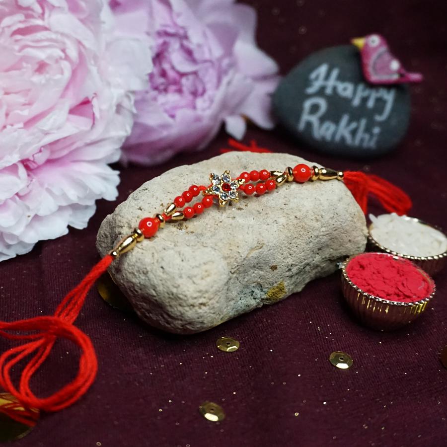 Traditional Simple RAKHI W/ Red Beads + Roli & Chaval Traditional Simple RAKHI W/ Red Beads + Roli & Chaval