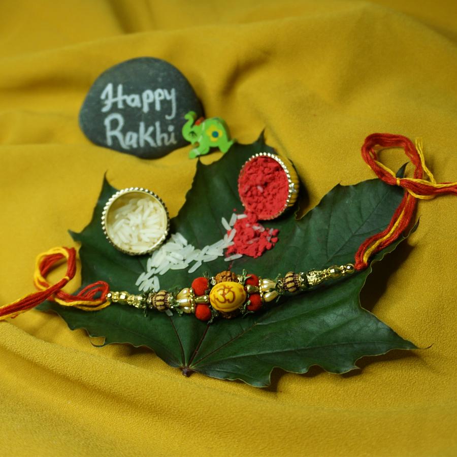 Om Carved RAKHI With Beads and Unique Design + Roli & Chaval