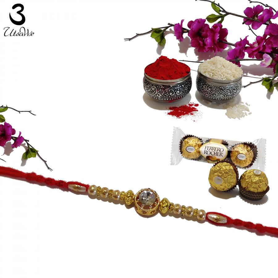 RAKHI in White & Golden Beads w/ Auspicious Diamonds W/ Roli & Chaval RAKHI in White & Golden Beads w/ Auspicious Diamonds W/ Roli & Chaval