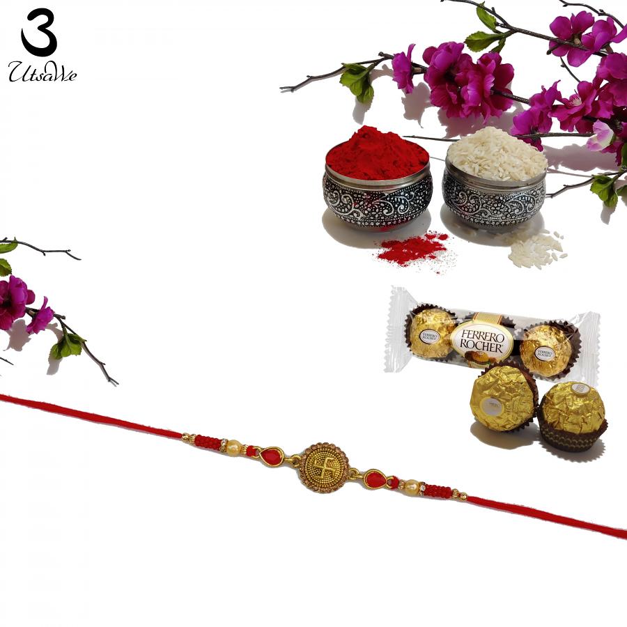 Swastika RAKHI W/ Ruby Like Stones & Mahogany Diamonds + Roli & Chaval Swastika RAKHI W/ Ruby Like Stones & Mahogany Diamonds + Roli & Chaval