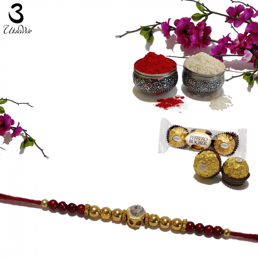 Diamond RAKHI Designed With Golden and Brown Beads W/ Roli & Chaval Diamond RAKHI Designed With Golden and Brown Beads W/ Roli & Chaval