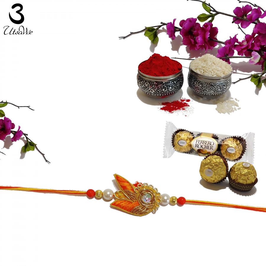 Alluring Orange Zardosi Rakhi With Polished Pearls + Roli & Chaval Alluring Orange Zardosi Rakhi With Polished Pearls + Roli & Chaval