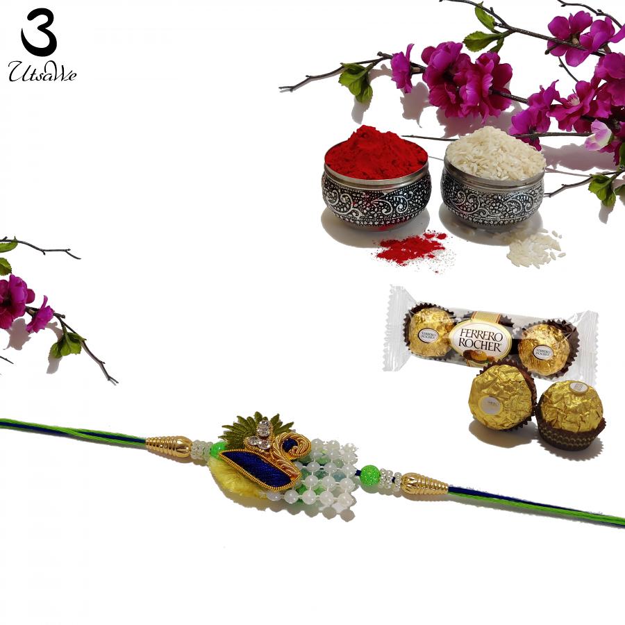 Auspicious Zardozi Beaded Rakhi With Peacock Design + Roli & Chaval Auspicious Zardozi Beaded Rakhi With Peacock Design + Roli & Chaval