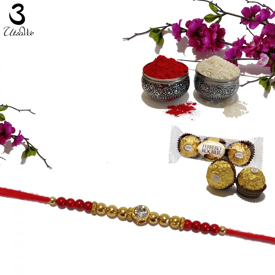 Diamond RAKHI Designed With Golden and Red Beads W/ Roli & Chaval Diamond RAKHI Designed With Golden and Red Beads W/ Roli & Chaval