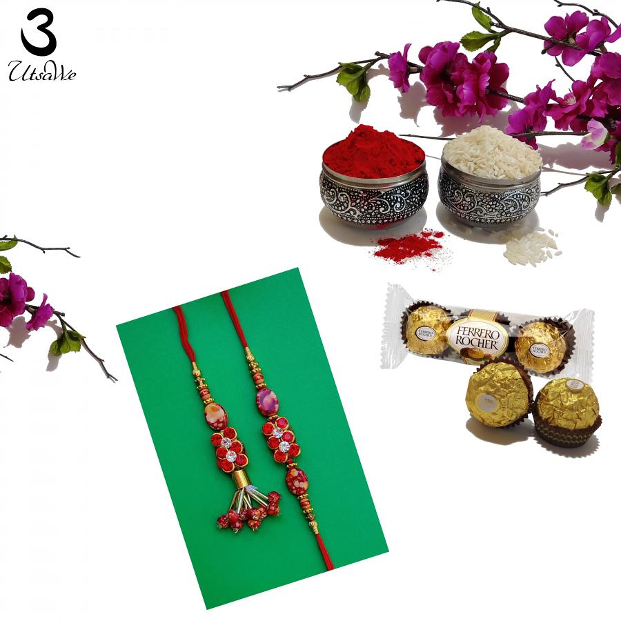 Delightful Lumba Bhaiya Bhabhi Red Kundan Rakhi + Roli & Chaval Delightful Lumba Bhaiya Bhabhi Red Kundan Rakhi + Roli & Chaval