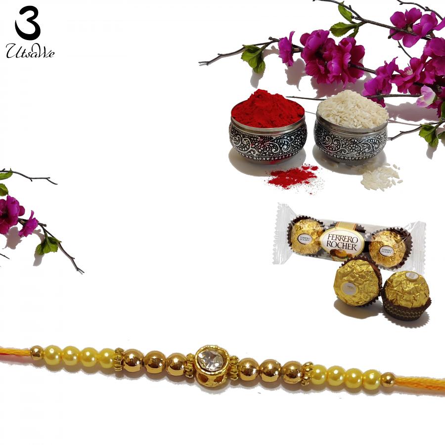 Diamond RAKHI Designed W/ Golden and Yellow Beads + Roli & Chaval Diamond RAKHI Designed W/ Golden and Yellow Beads + Roli & Chaval
