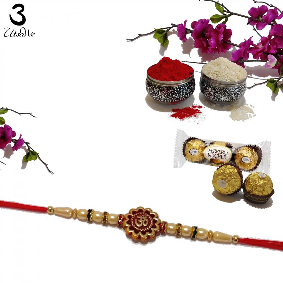 Om Carved RAKHI With Beads and Diamonds on Golden Rings + Roli & Chaval Om Carved RAKHI With Beads and Diamonds on Golden Rings + Roli & Chaval