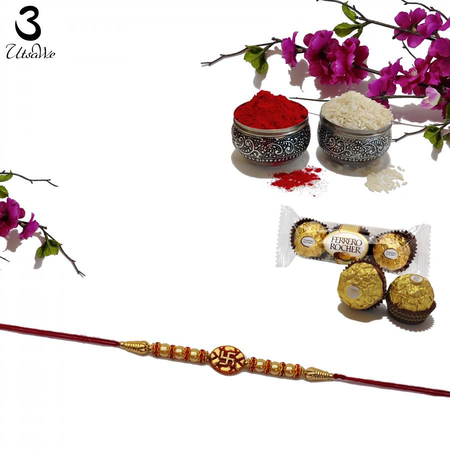Swastika RAKHI in Gold W/ Red Beads and Diamonds + Roli & Chaval Swastika RAKHI in Gold W/ Red Beads and Diamonds + Roli & Chaval
