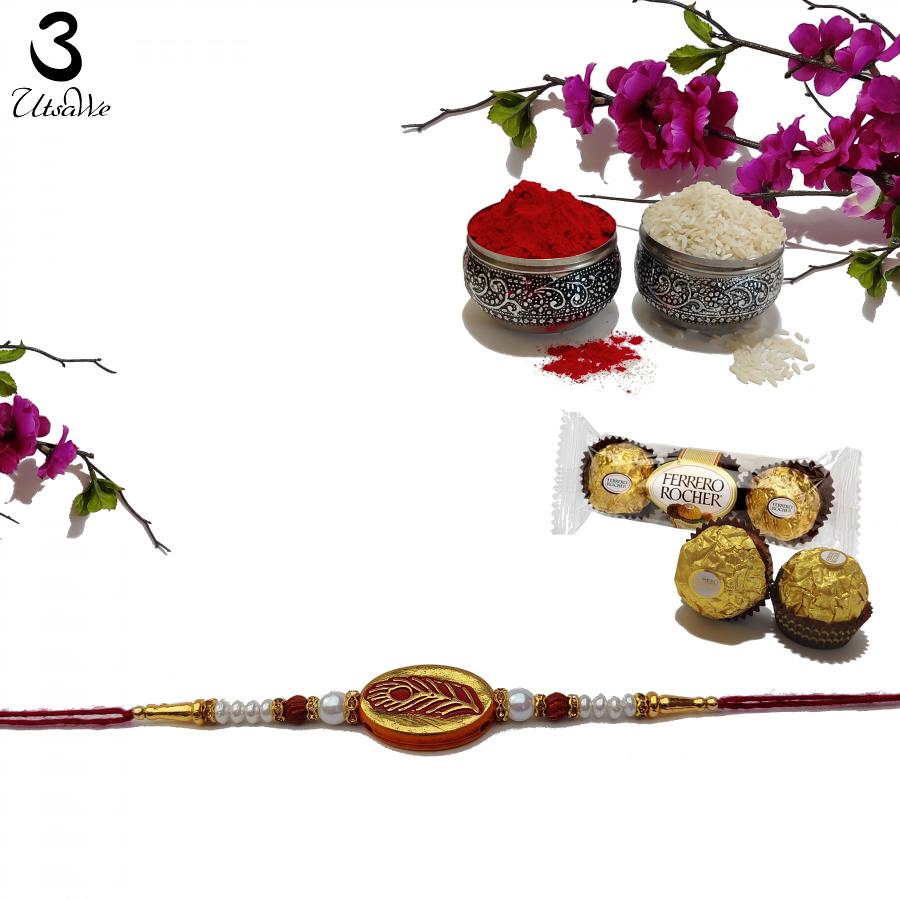 Peacock Feather in Gold RAKHI W/ Rudraksha and Beads W/ Roli & Chaval Peacock Feather in Gold RAKHI W/ Rudraksha and Beads W/ Roli & Chaval