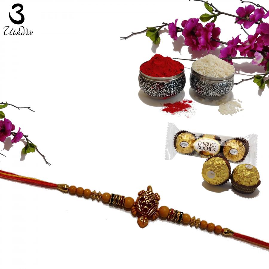 Lucky Turtle RAKHI In Gold with Wooden Beads Roli & Chaval Lucky Turtle RAKHI In Gold with Wooden Beads Roli & Chaval