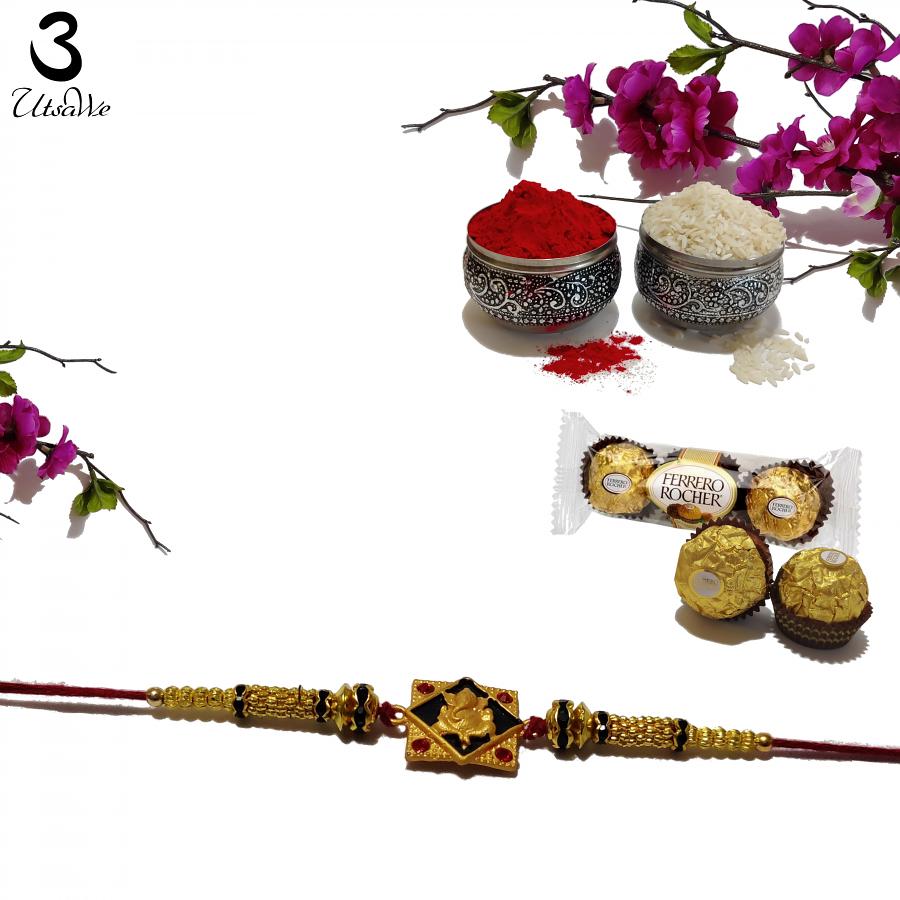 Fancy RAKHI in Gold with Lord Ganesh + Roli & Chaval Fancy RAKHI in Gold with Lord Ganesh + Roli & Chaval