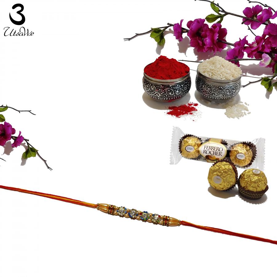 Appealing Multi-Color Diamond Crafted Golden Jewel Rakhi + Roli & Chaval Appealing Multi-Color Diamond Crafted Golden Jewel Rakhi + Roli & Chaval