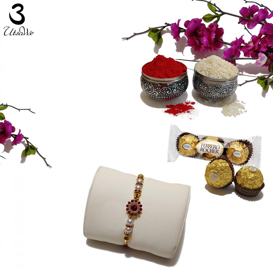Sparkling Red Rakhi with the Beauty of Precious Stones + Roli & Chaval Sparkling Red Rakhi with the Beauty of Precious Stones + Roli & Chaval