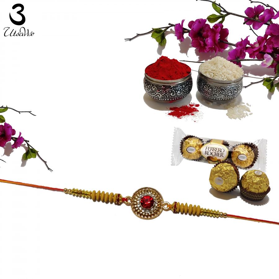 Ruby Rakhi with Intricate Diamond Arrangement + Roli & Chaval Ruby Rakhi with Intricate Diamond Arrangement + Roli & Chaval