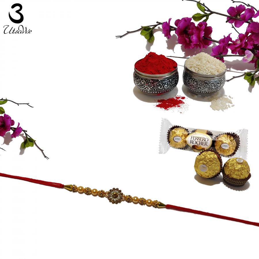 Creamy Pearl Rakhi with Mahogany and Crystal Diamonds + Roli & Chaval Creamy Pearl Rakhi with Mahogany and Crystal Diamonds + Roli & Chaval