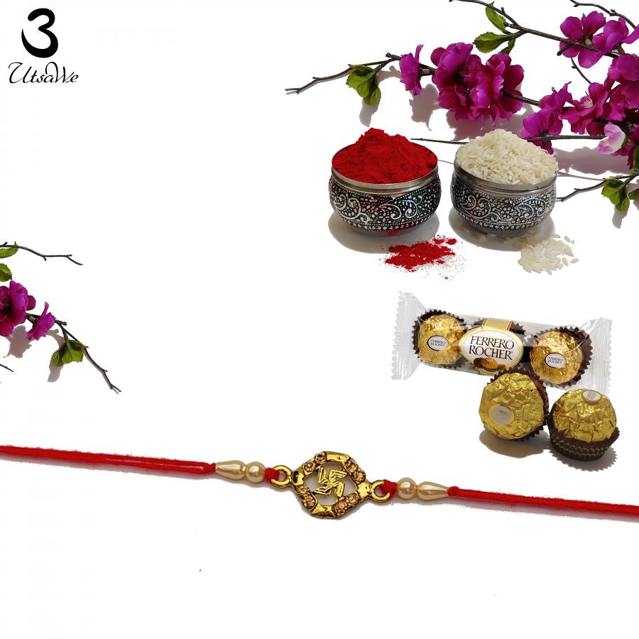 Designer Swastika Rakhi with Amber Diamonds and Peals + Roli & Chaval Designer Swastika Rakhi with Amber Diamonds and Peals + Roli & Chaval