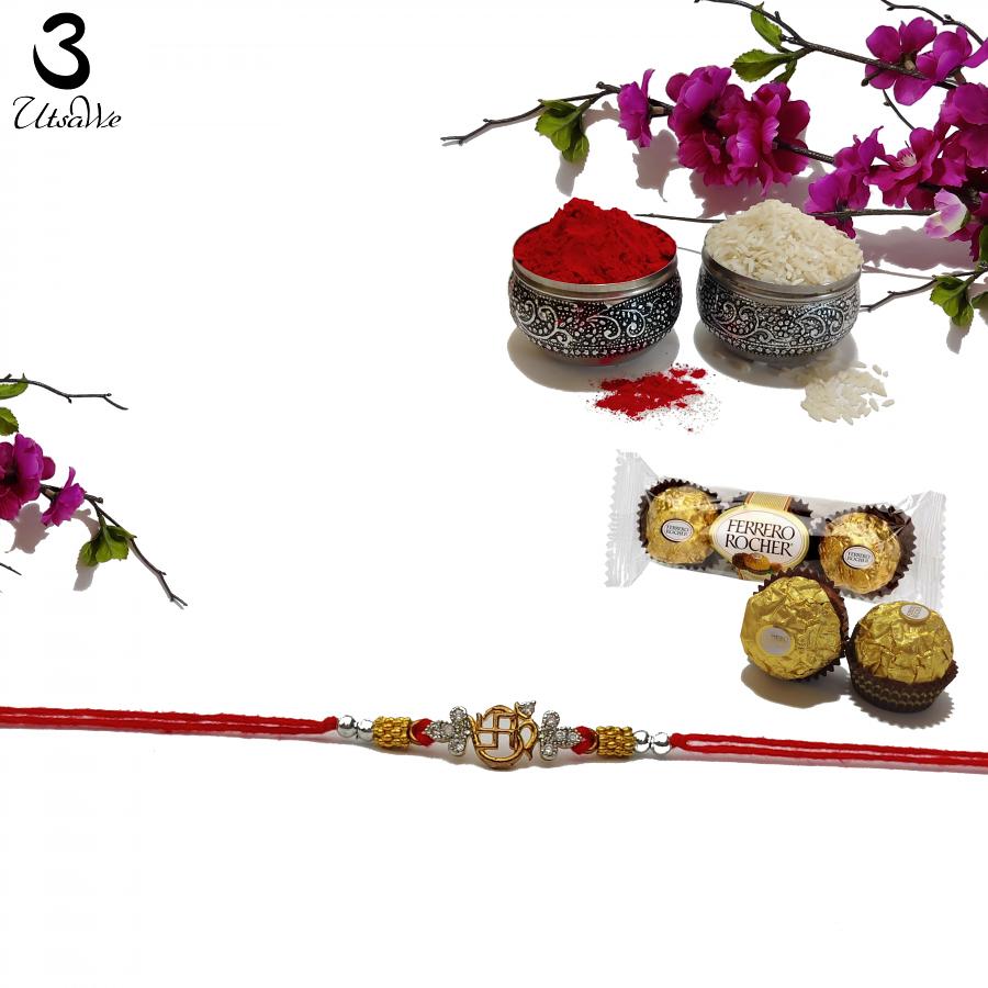 Golden Om and Swastika Rakhi With Traditional Ornaments + Roli & Chaval Golden Om and Swastika Rakhi With Traditional Ornaments + Roli & Chaval