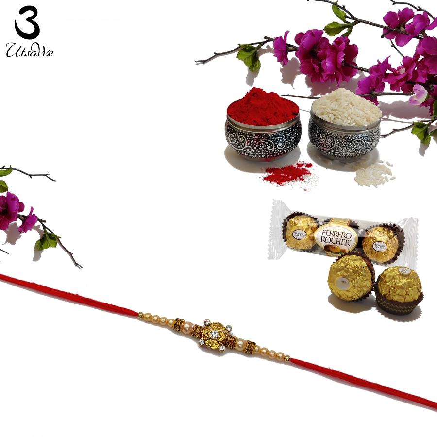 Royal Gold RAKHI with Polished Pearls and Diamonds + Roli & Chaval Royal Gold RAKHI with Polished Pearls and Diamonds + Roli & Chaval