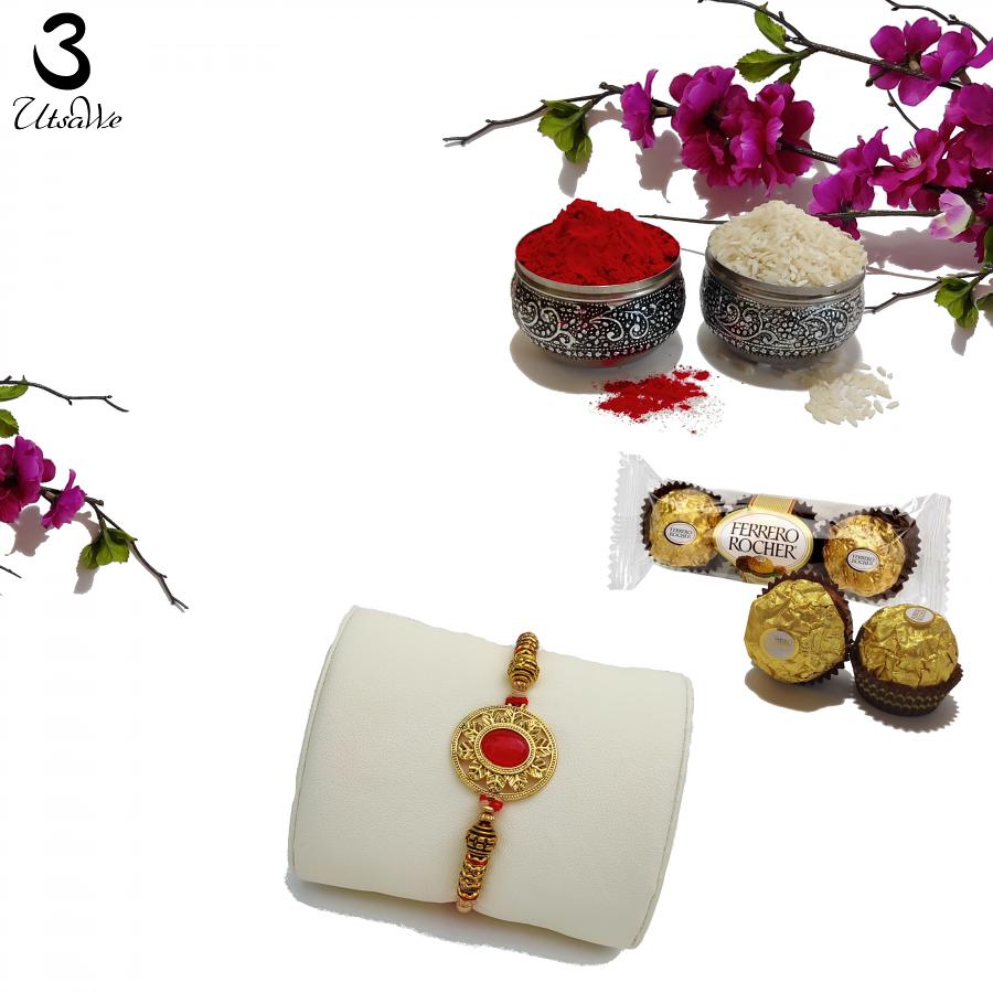Classy RAKHI W/ an Embedded Ruby Like Stone W/ Golden Craft + Roli & Chaval