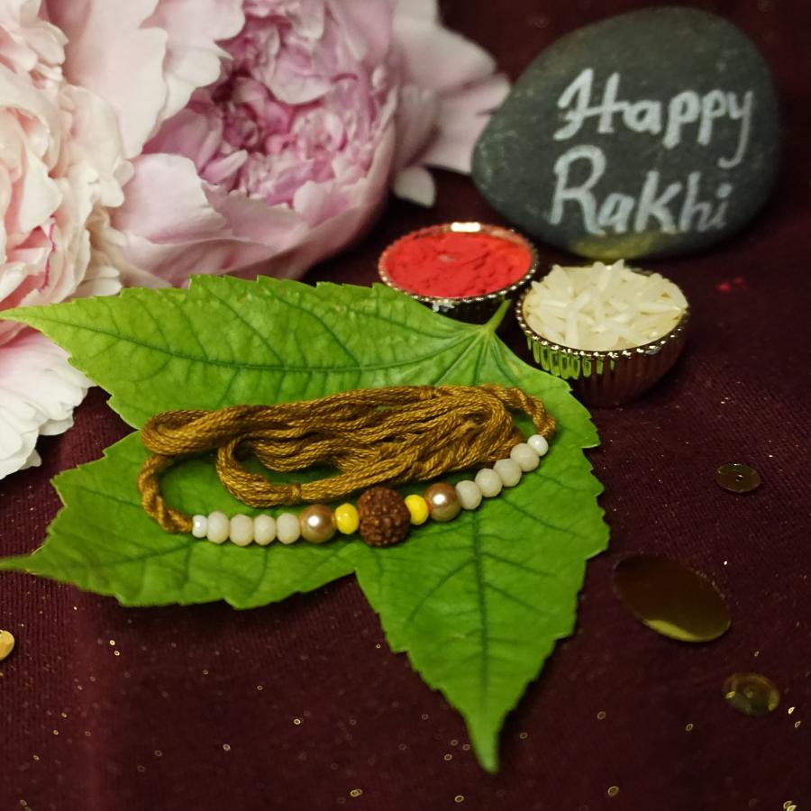 Traditional RAKHI Crafted W/ Rudraksha and beautiful Beads + Roli & Chaval Traditional RAKHI Crafted W/ Rudraksha and beautiful Beads + Roli & Chaval