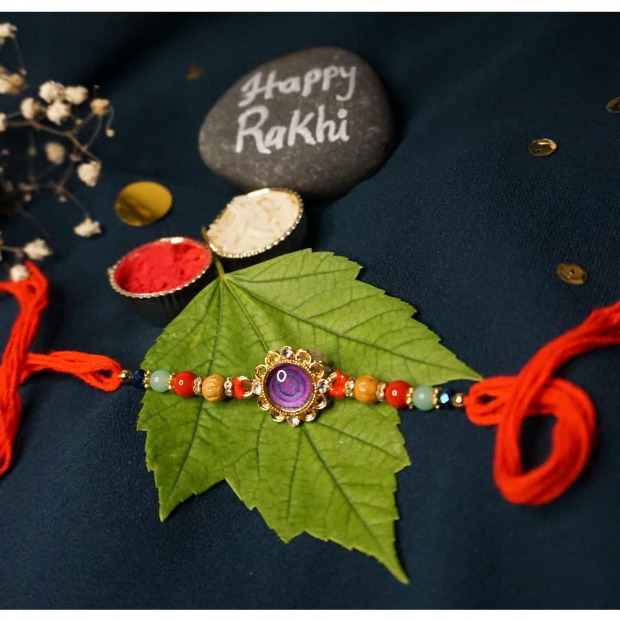 Royal Purple Rakhi With Handcrafted Ornaments + Roli & Chaval