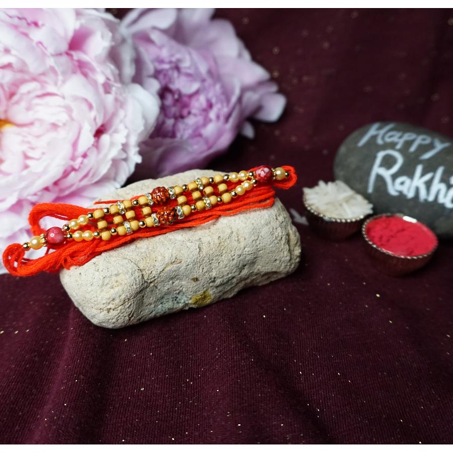 Aesthetic Rakhi with Wooden & Golden Ornaments + Roli & Chaval Aesthetic Rakhi with Wooden & Golden Ornaments + Roli & Chaval