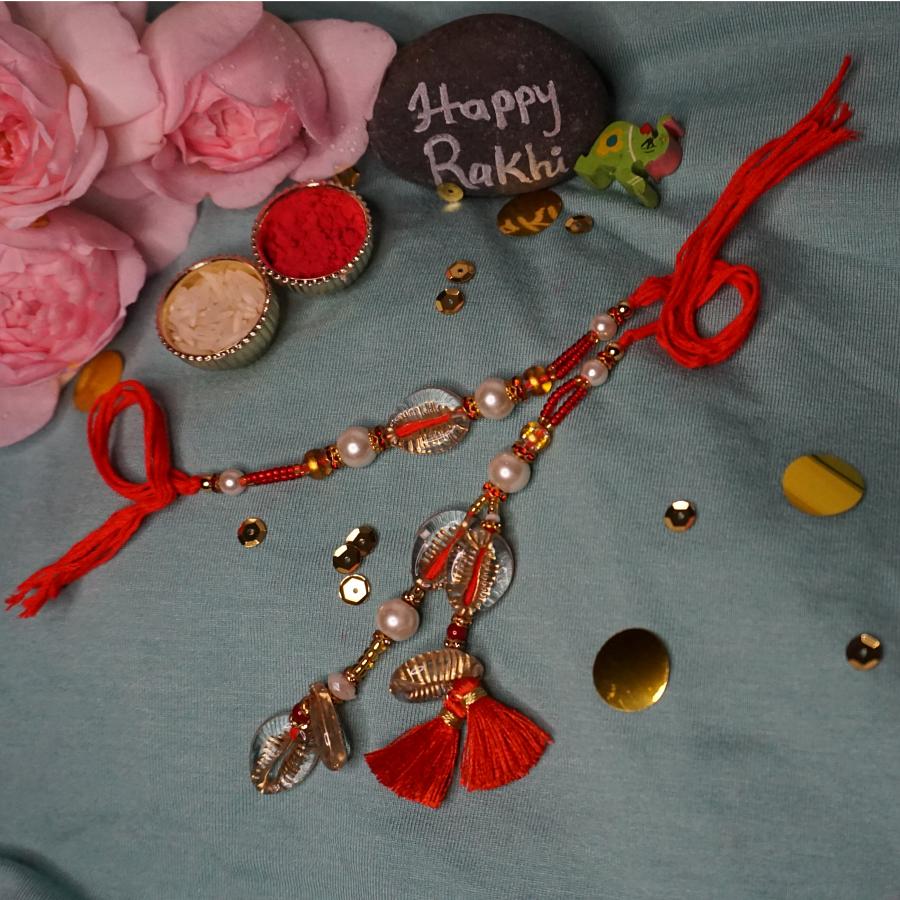 Beautiful Red Lumba Rakhi With Tassel + Roli and Chaval