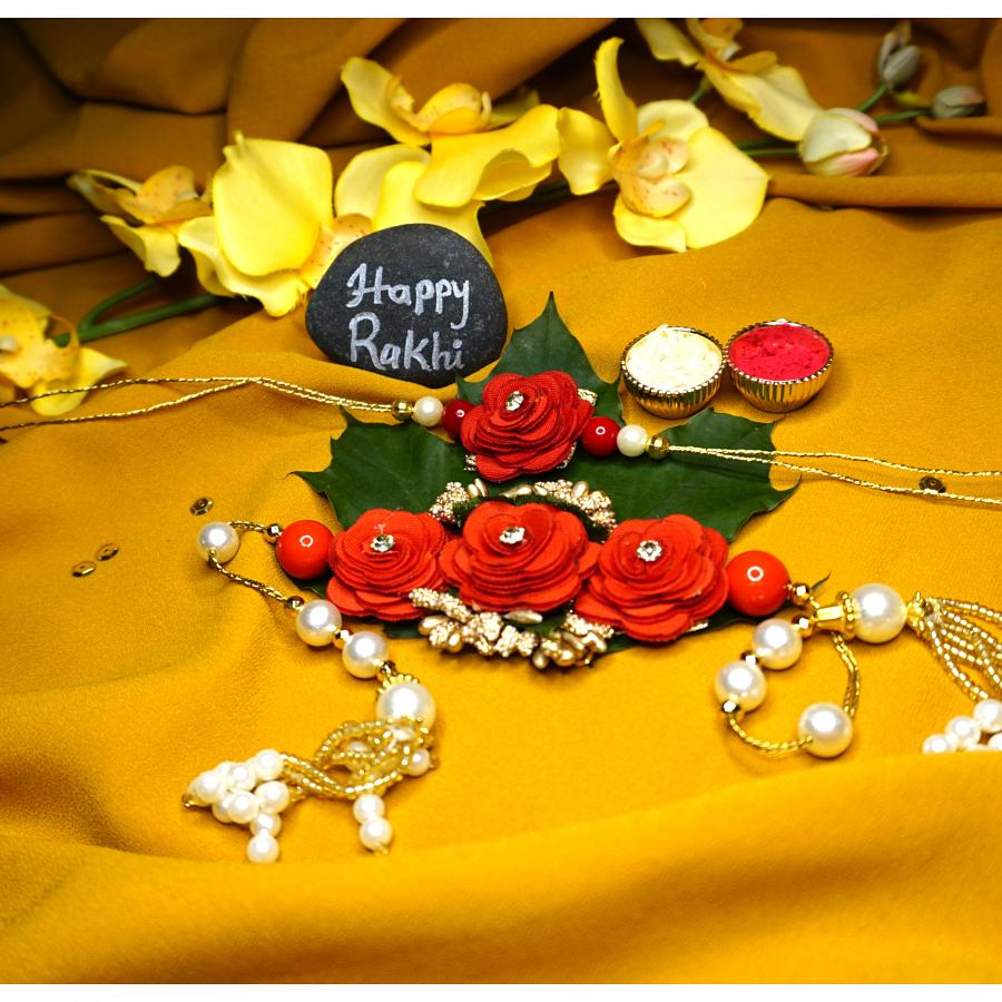 Beautiful Red Blossom Lumba Bhaiya Bhabhi Rakhi + Roli & Chaval Beautiful Red Blossom Lumba Bhaiya Bhabhi Rakhi + Roli & Chaval