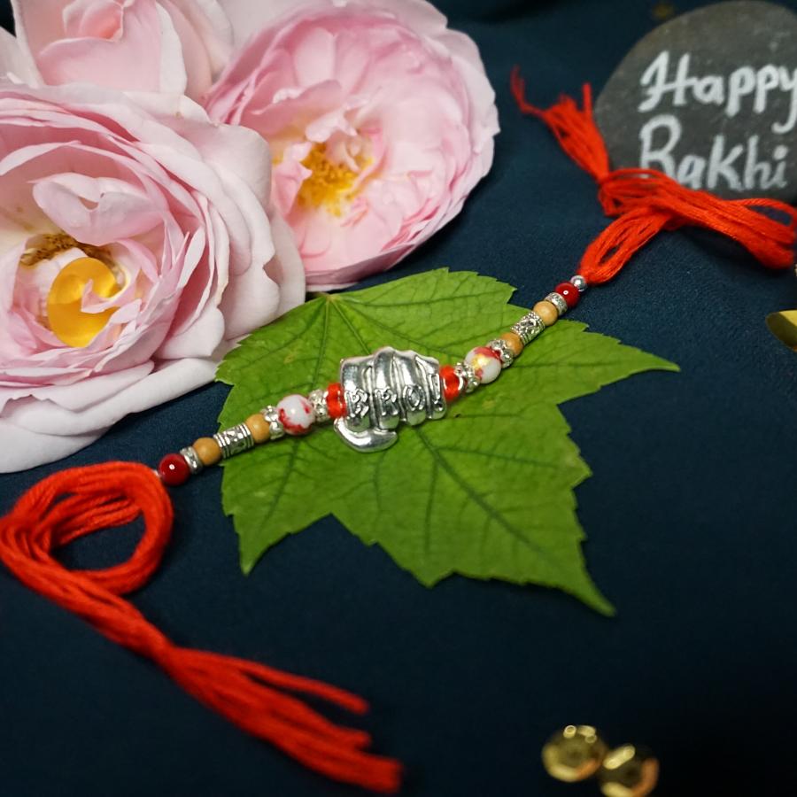 Special Silver BRO Rakhi With Adorable Beads + Roli & Chaval Special Silver BRO Rakhi With Adorable Beads + Roli & Chaval