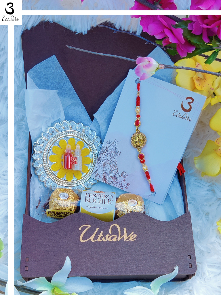 Swastika RAKHI Gift Set W/ Ruby Like Stones + Roli, Chaval, Card, Chocolate Swastika RAKHI Gift Set W/ Ruby Like Stones + Roli, Chaval, Card, Chocolate