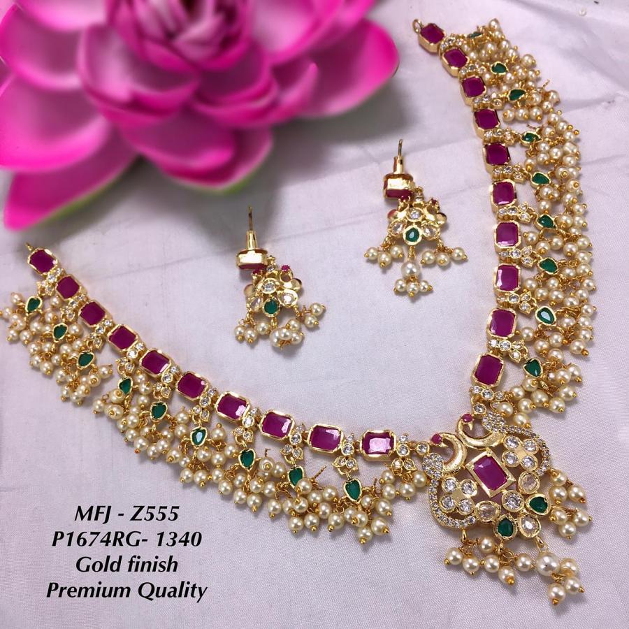 Gold Finish Guttapusulu Peacock Pendant Necklace with Earrings-Ruby and Eme Gold Finish Guttapusulu Peacock Pendant Necklace with Earrings-Ruby and Eme