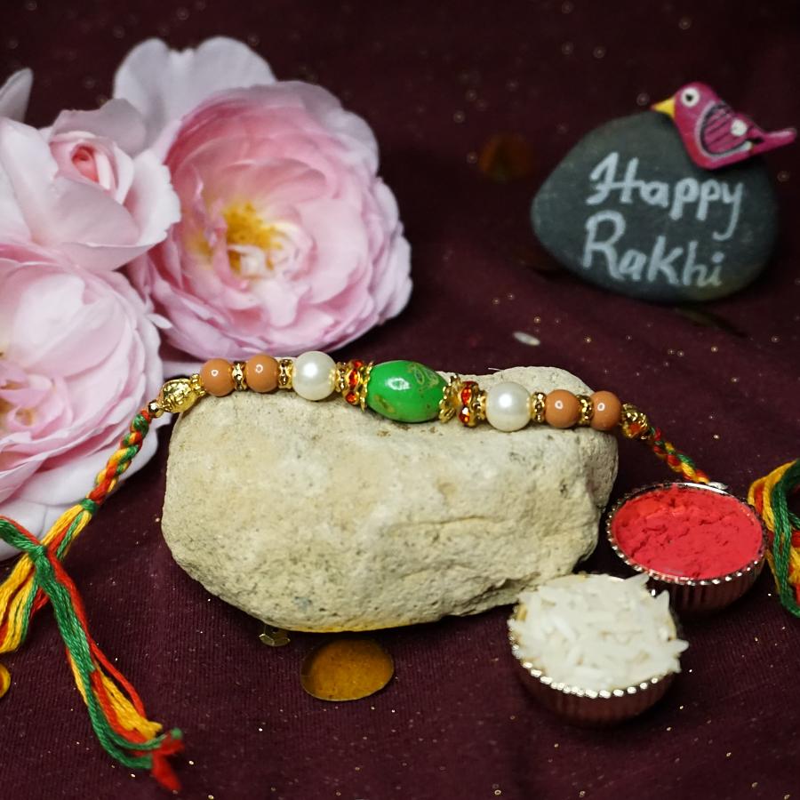 Elegant Greenstone Rakhi W\ Fancy beads + Roli and Chaval