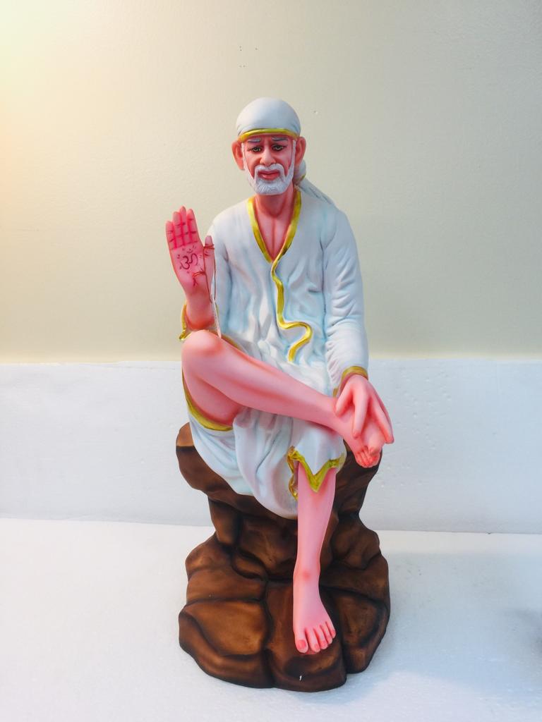 Beautiful n Colorful Fiber Statue of Sai Baba Sitting on Rock- 18.25"