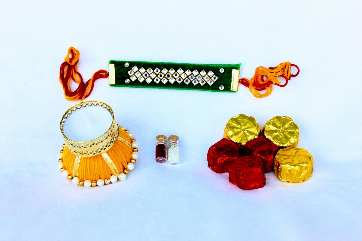 Kundan Rakhi Thali w/Diya, Roli Chawal & Free Homemade Chocolates (6) Kundan Rakhi Thali w/Diya, Roli Chawal & Free Homemade Chocolates (6)