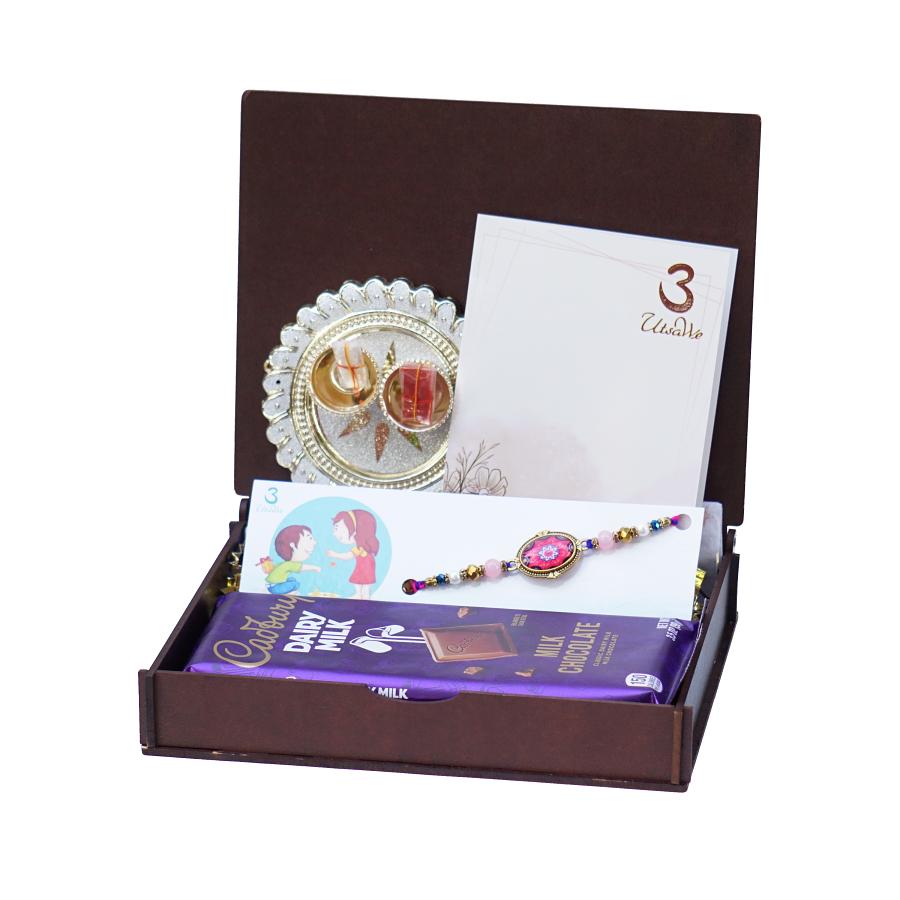 UtsaWe GIFT HAMPER - Rajwadi Rakhi W/ a Beautiful Gems Surrounded By Stones UtsaWe GIFT HAMPER - Rajwadi Rakhi W/ a Beautiful Gems Surrounded By Stones