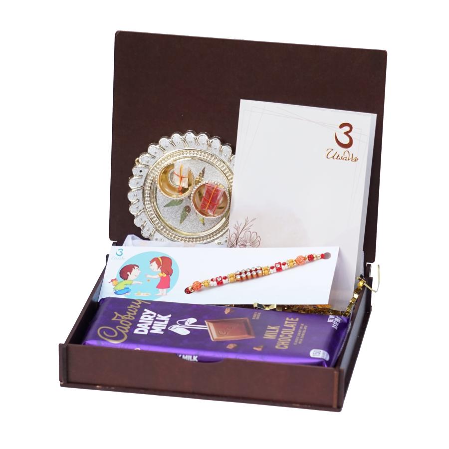 UtsaWe GIFT HAMPER -Eye-catchy Simple Rakhi W/ Pearls and Diamonds UtsaWe GIFT HAMPER -Eye-catchy Simple Rakhi W/ Pearls and Diamonds