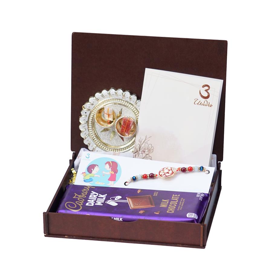 UtsaWe GIFT HAMPER - Auspicious Red Meena Rakhi With American diamonds
