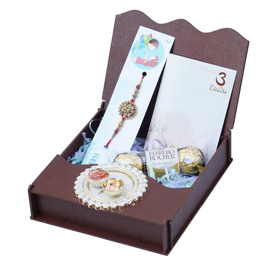 UtsaWe GIFT HAMPER - Golden Laxmi Rakhi Adorned with Intricate Ruby 