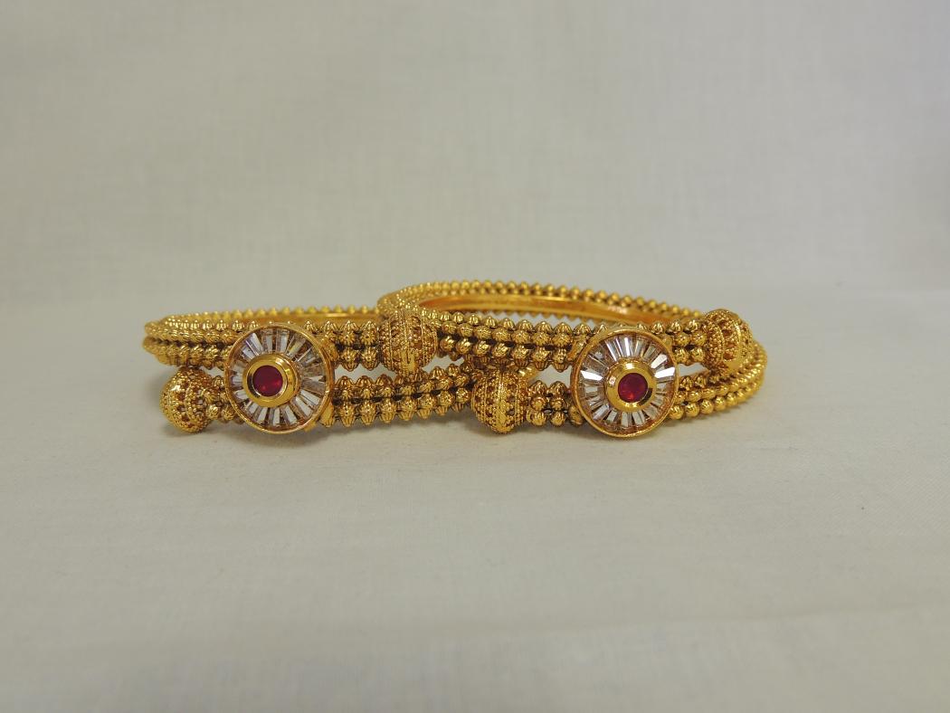 Eye of War - Golden Bracelet w/ Large Red Stone Bangles (Set of 2) Eye of War - Golden Bracelet w/ Large Red Stone Bangles (Set of 2)