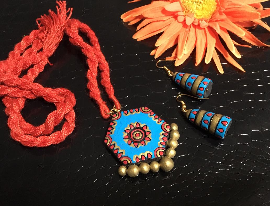 Light Blue and red Terracotta pendant set in a long rope with jhumkas!!!!